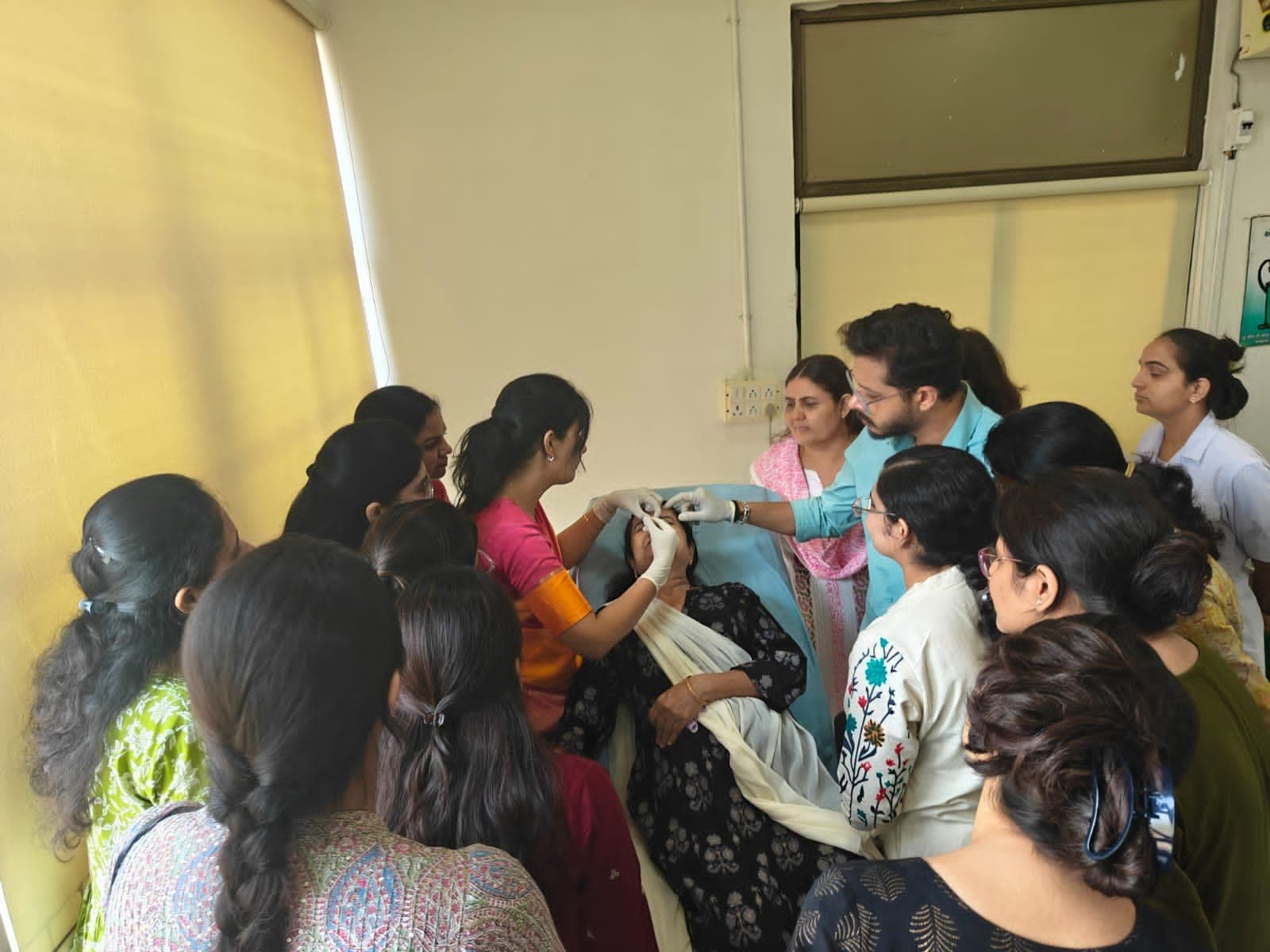 Dr. Neha Shukla presenting certificate — graduate 16