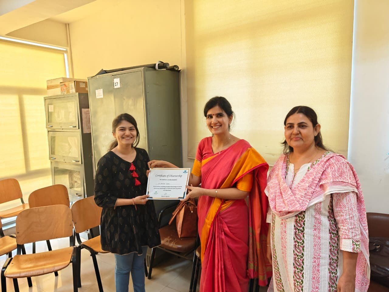 Dr. Neha Shukla presenting certificate — graduate 21