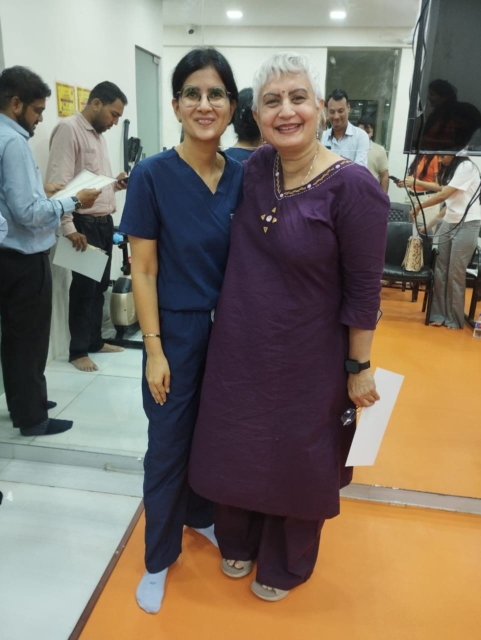 Dr. Neha Shukla presenting certificate — graduate 8